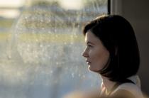 By the window.